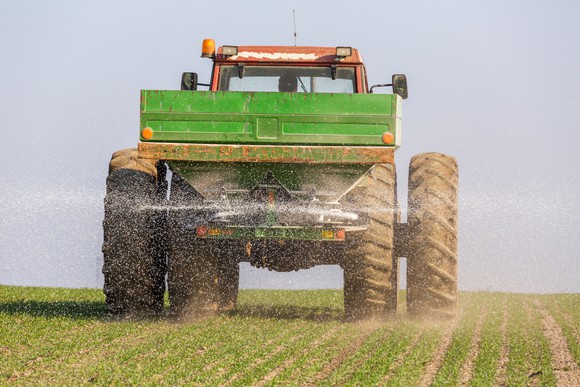 A combine applying fertilizer on a field.